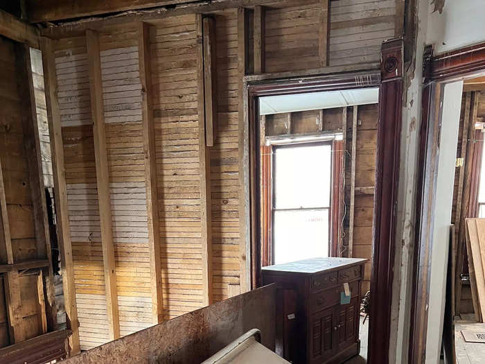 An old detached bathtub on its side.