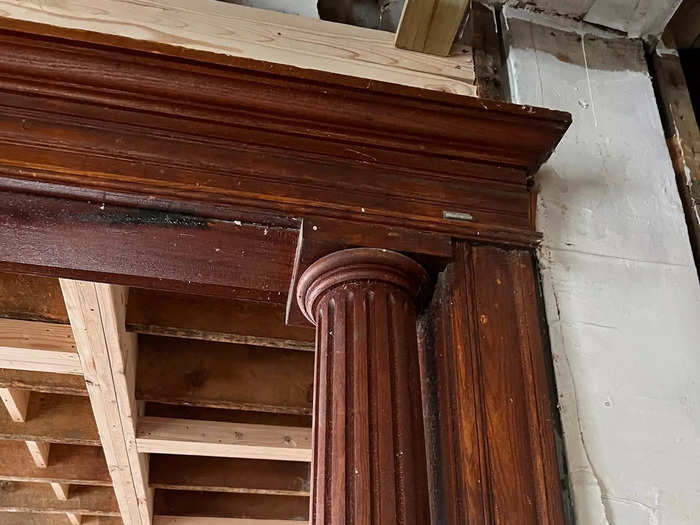 A wooden pillar in an archway.