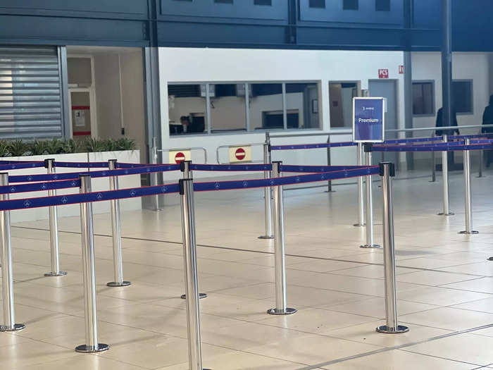 Because everyone has to collect their boarding pass from the ticket counter, arrive early to avoid a long queue. Or, you could book a premium economy fare that has a designated line.