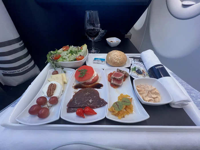 The dinner service started shortly after takeoff, which consisted of cheese, tuna, salad, bread, and bell pepper dip.