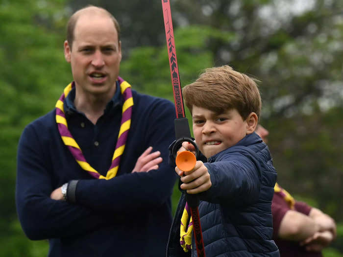 George was all focus as William looked on proudly as he practiced some archery during a national day of volunteering in the UK following Charles