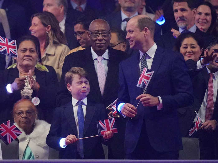 George pulled a funny face while William was all smiles later in the evening at the coronation concert when the crowd waved Union Jack flags.