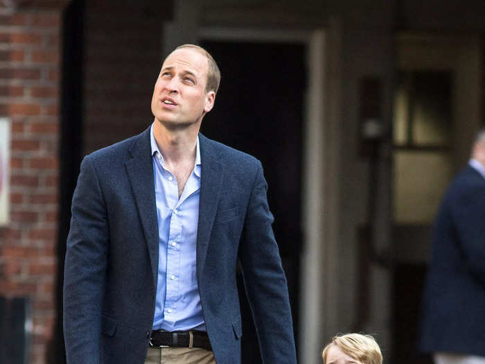 George looked up at William, who held his hand, with a seemingly nervous expression as they arrived for his first day of school that same year.