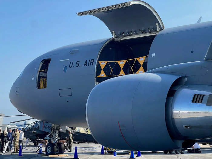 The freight configuration can accommodate up to 65,000 pounds of cargo across 18 pallets, which loadmasters Tetris into the jet via a large side door.