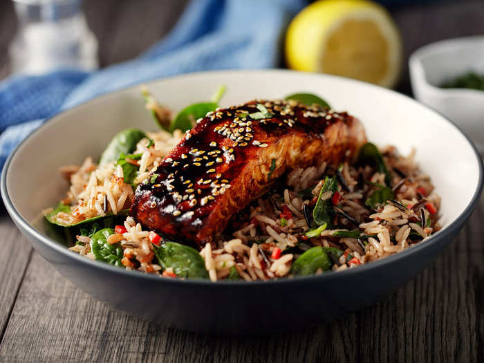 Baked oily fish with wholegrain rice and sautéed green vegetables