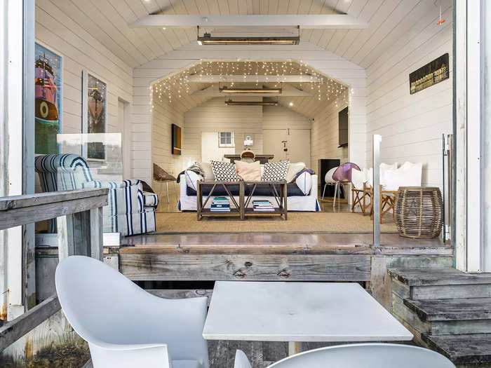 Looking into the shed from the waterfront decking, you start to see its smart white interior.