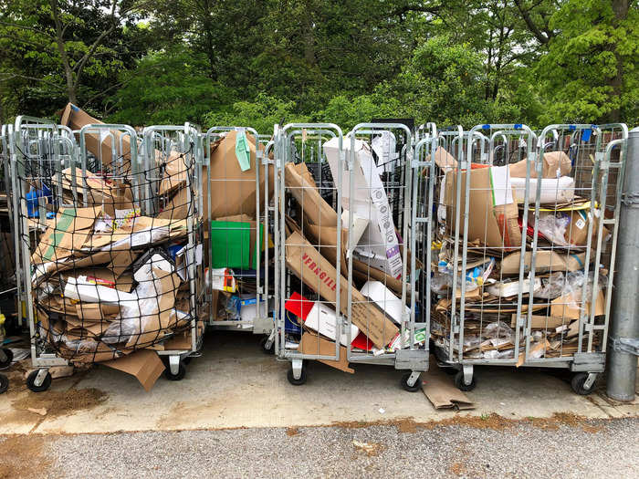 Outside, I found rolltainers that were mostly full of cardboard boxes.