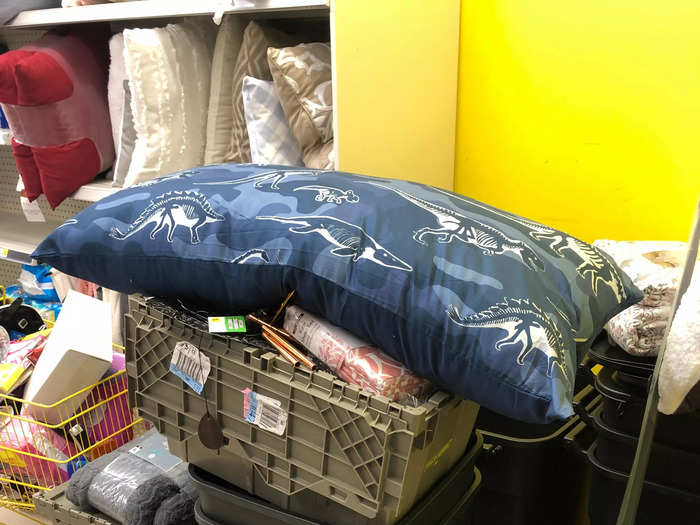 Grey plastic totes used to ship inventory from Dollar General distribution centers sat overflowing — or, in this case, on top of — the stuff that was actually for sale.