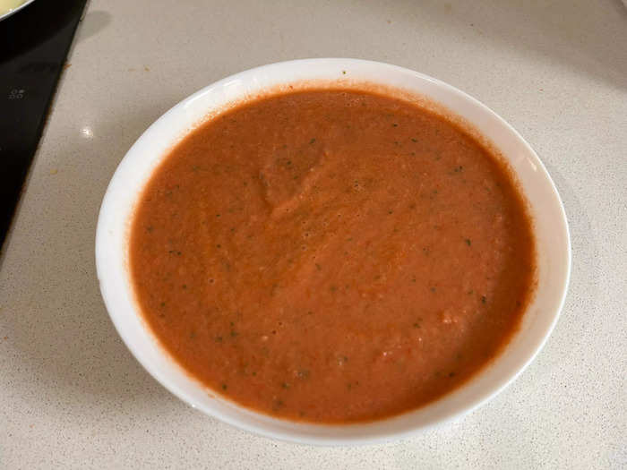 I placed my soup into a bowl. You can sieve it, but I liked the chunky texture. Then I put it into the fridge for three hours, which is crucial because this is where the flavors develop while the soup chills.