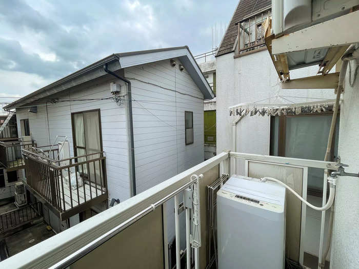 And the space continued outside, where Crouse had a private balcony. Here, he had a table and chair — which Crouse said he never used — and a washing machine.