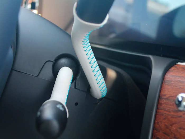 Even the stalks attached to the steering column were wrapped in leather and featured the same blue accent stitching that striped around the rest of the cabin.