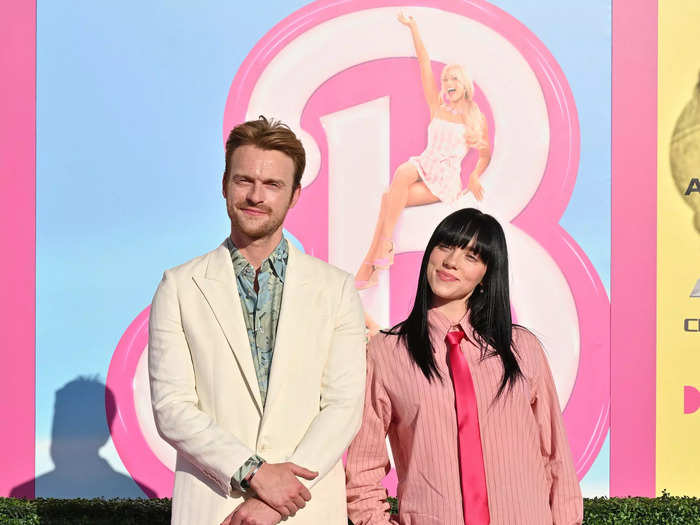 Musical sibling superstars Finneas and Billie Eilish posed together on the carpet.