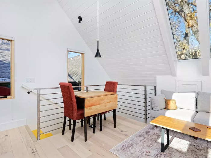 The 356-square-foot living area on the second floor is filled with light from the many windows including several skylights.