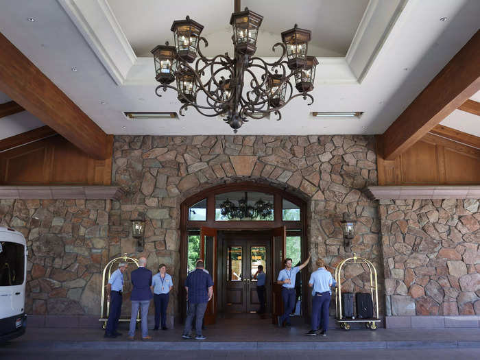 Each year, photographers await the arrival of the CEOs, dealmakers, and media moguls in front of the Sun Valley Lodge.