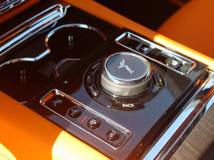 A central knob for controlling the screen prominently displayed the iconic, winged Spirit of Ecstasy symbol.