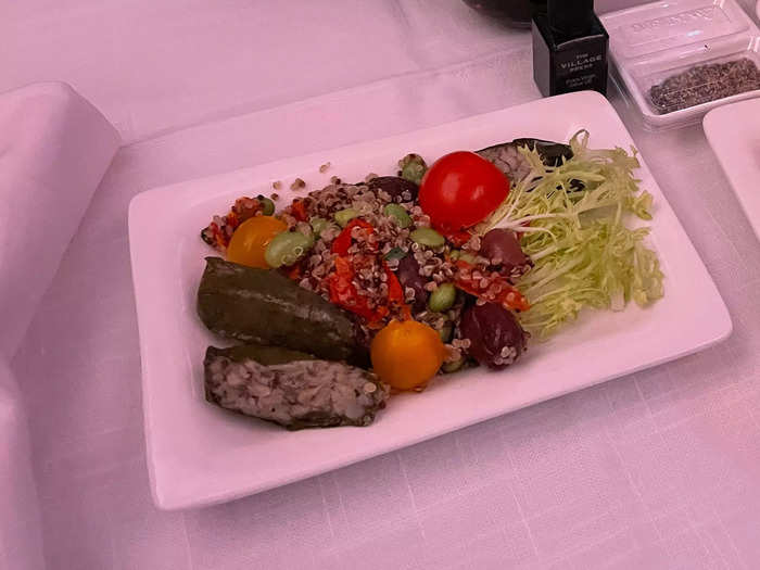 My first course in business class was a salad with stuffed grape leaves, quinoa, tomatoes, olives, and lettuce.