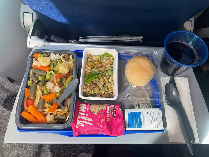 Unlike in economy, where a tray with all my food was delivered at once.