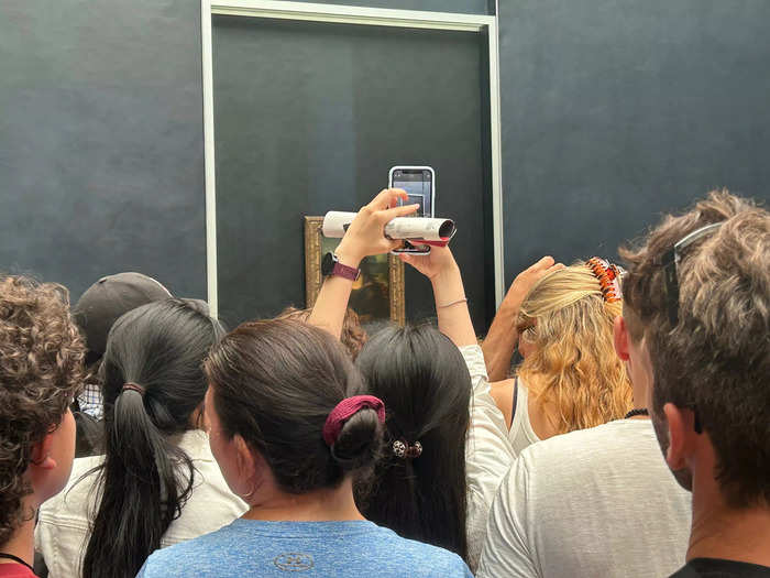 A long and winding line got visitors close to the painting — but cell phones obstructed the view.