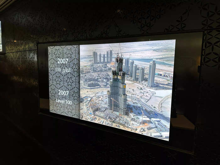 Along the same hallway, there was an image of what the building looked like when level 100 of its 163 floors was built in 2007.