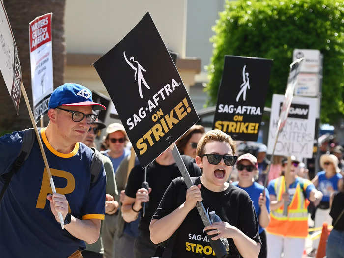 Outside of Paramount Studios, "Once Upon a Time" actor Ginnifer Goodwin held a sign and joined in on chants on the picket line.