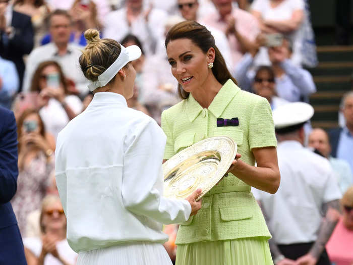 Kate Middleton went for green again in a lime, midi dress by Self-Portrait to present the women