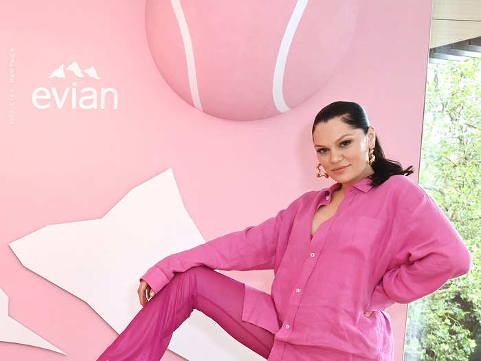 British singer Jessie J nailed the Barbiecore trend in a pink, button-down shirt and matching, flared pants. She accessorized with a pair of gold, heeled sandals and statement earrings.