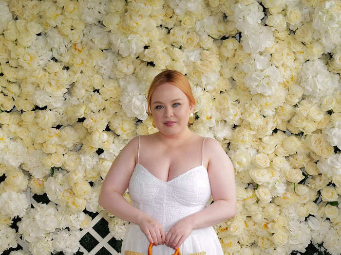 Nicola Coughlan went for a romantic look in a white, Ralph Lauren gown with spaghetti straps and a sweetheart neckline. The summery dress fell to her ankles. She styled her hair in an updo and accessorized with heeled sandals and a straw bag.