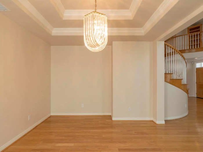 The dining room was dark and small, though it had a tray ceiling and a large chandelier.