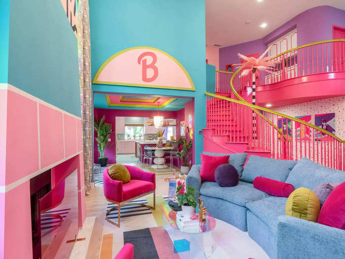 The designers put the Barbie logo on a plaque on the wall, and they filled the room with retro furniture, including a curved, denim couch that screamed 1990s.