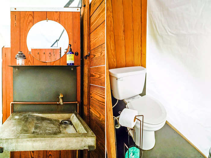 The bathroom was at the end of the tent behind a wooden wall for privacy.