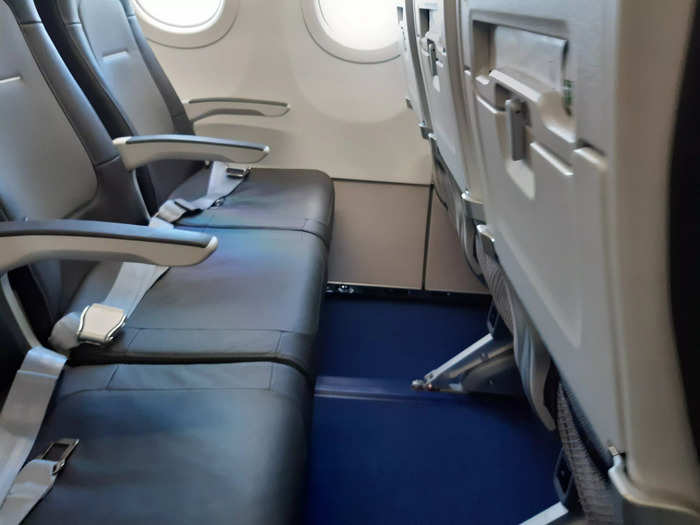 The business-class cabin had three seats on each side, as in economy — but the middle seats were left empty in each row.