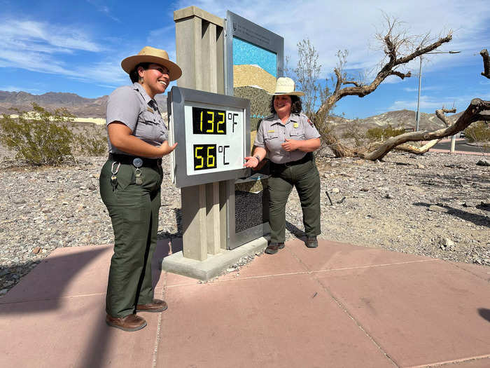 Also photographed by the temperature display were two park rangers, who smiled as the unofficial thermometer read 132 degrees Fahrenheit, just two degrees off the hottest temperature ever recorded in 1913.