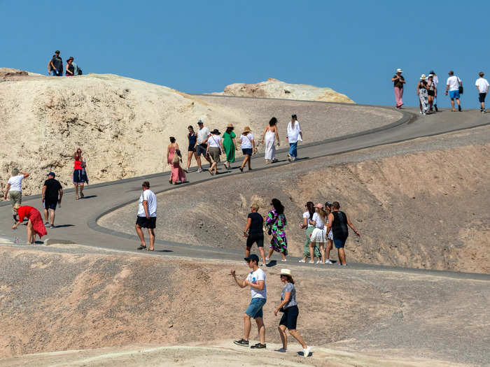 Warnings aside, tourists arrive at the valley in droves. Most wear hats, shorts, sun dresses, and sunglasses in a likely futile attempt to stay cool amid sky-rocketing temperatures.