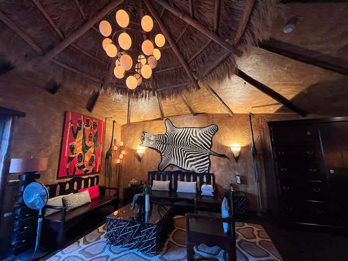 Animal-print decor, wooden sculptures, and bright paintings adorned the suite.