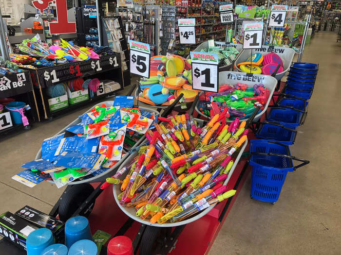 Immediately after walking in, I found these wheelbarrows full of slingshots, bubble wands, and other toys. Maybe that retail analyst was right about toys after all.