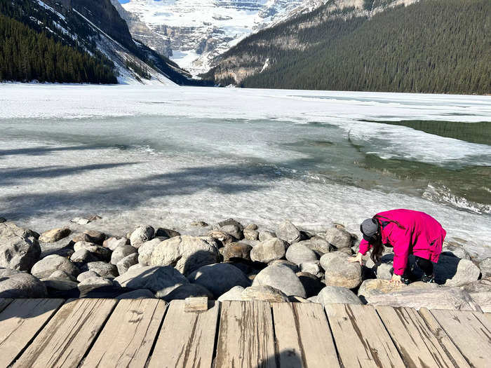 I noticed a lot of tourists climbing down the rocks at the edge of the icy lake.