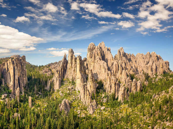 In South Dakota, hike through a ghost town in the Black Hills region and feed alpacas.