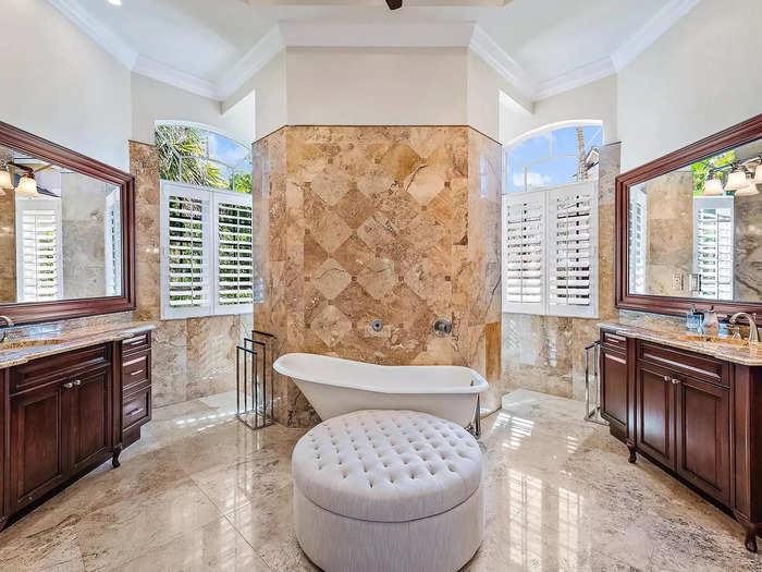 The adjoining bathroom is gorgeous with two vanities.