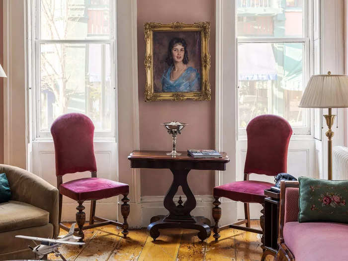 94 Bank Street is a four-bedroom townhouse filled with Romantic-era-inspired art with soft pink walls and jewel-toned furniture.