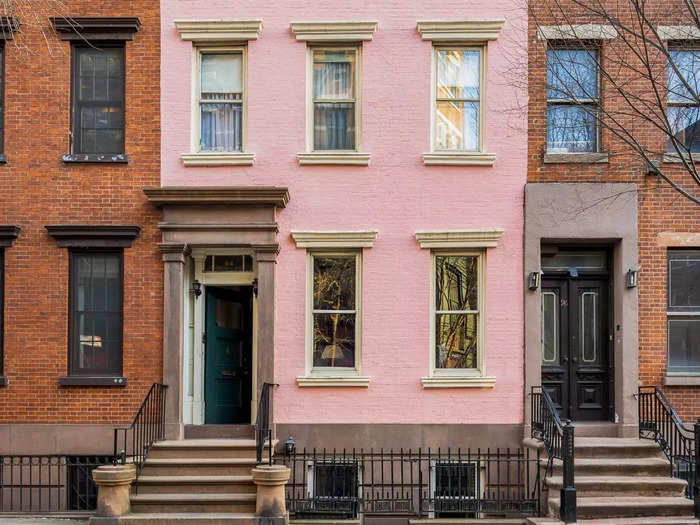 If Barbie was an artist and had a home in Manhattan, this would probably be it. A charming pink townhouse in New York City