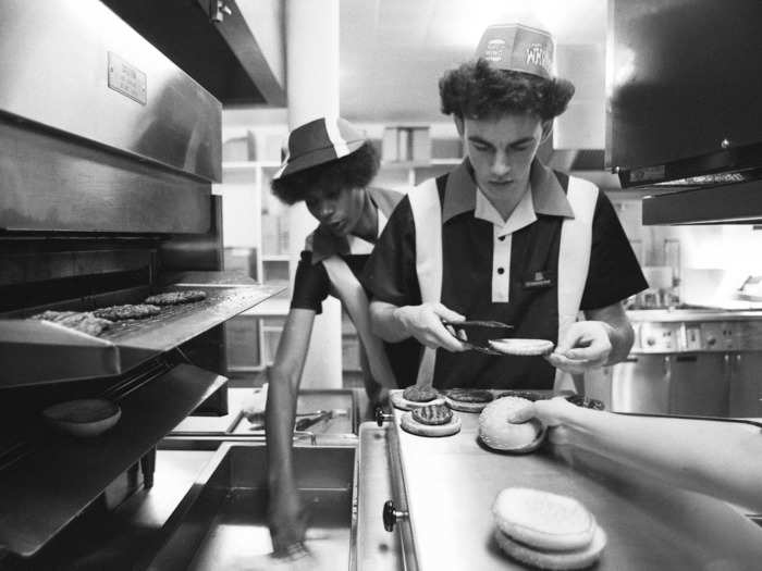 Employees wore hats and striped polo shirts.