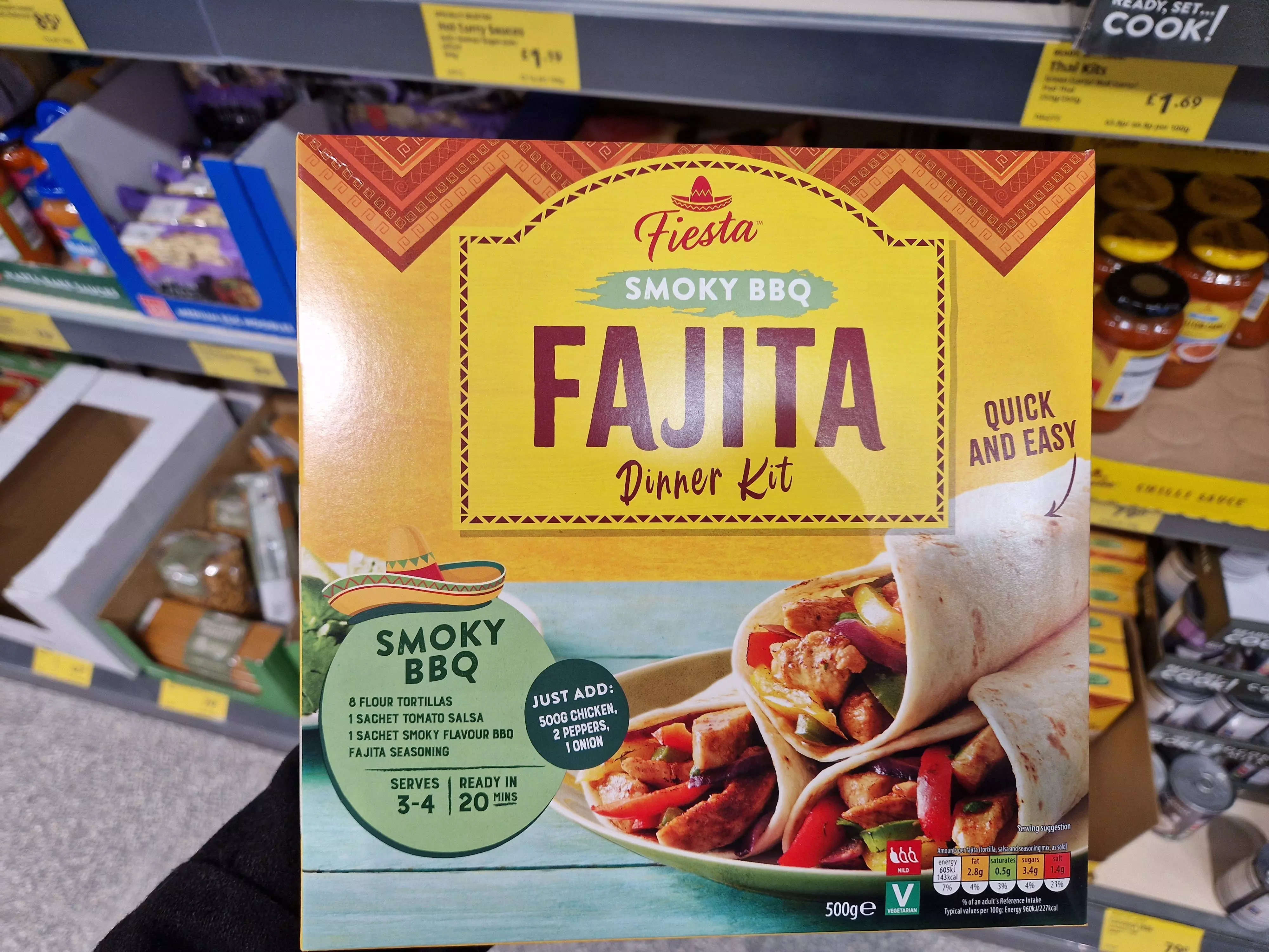The writer holds a Fiesta smoky BBQ fajita dinner kit