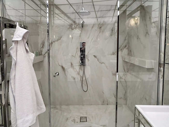 I loved how luxurious the bathroom felt, with marble floors and a sprawling walk-in shower. The only problem I noticed was the small gap under the shower door, which let water spill onto the floor when showering.