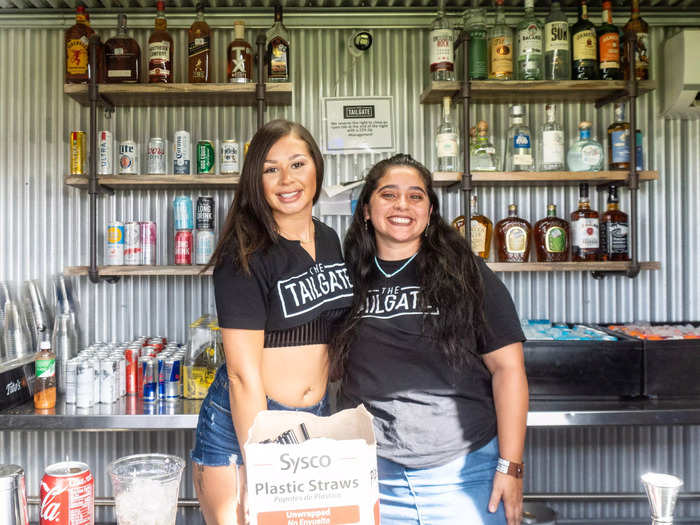 Two Tailgate employees posing for a picture.