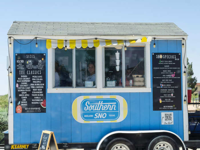 A snow cone stand featuring a young woman.