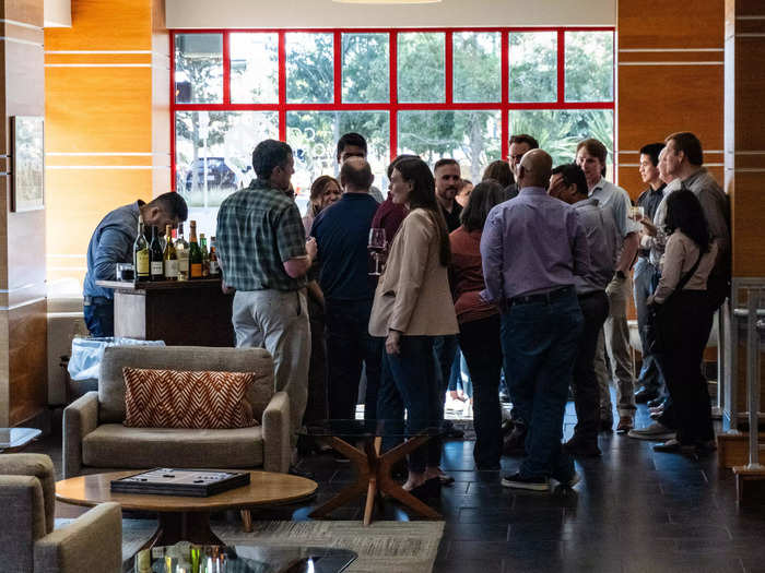 Young adults attending a business mixer.