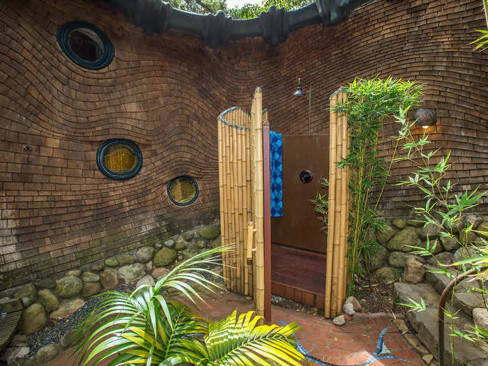 The interior courtyard includes a bamboo-lined outdoor shower.