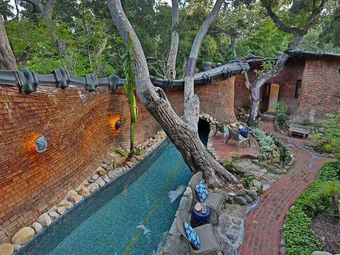 Oak trees grow over the 75-foot lap pool.