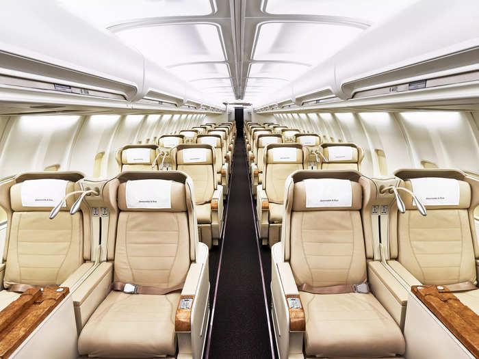 Each cream-colored lounger comes with typical first-class perks, including power, plenty of legroom, a large tray table, and lie-flat beds.