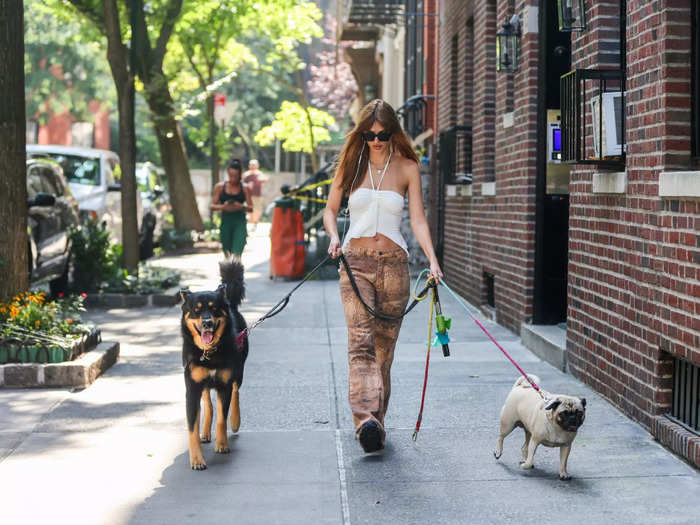 She also mixed a going-out top — a white halter that ruched in the middle — with a snakeskin pair of Gen Z